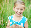 Cute little girl  on the meadow