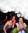 Young woman sitting at home and seductive devil coming to her an