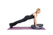 Fit young female pilates instructor showing different exercises