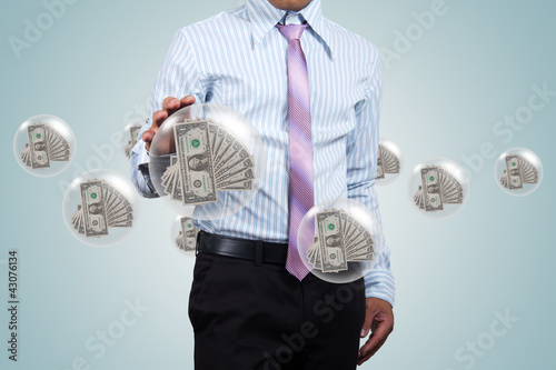 Photo: Holding a dollars. Holding a dollars.