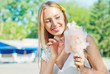 Photo: Girl eating cotton candy Girl eating cotton candy