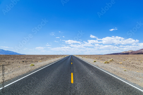 Photo: Death Valley road straight across the desert to the mountains in Death Valley road straight across the desert to the mountains in