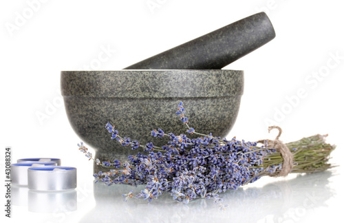 Photo: Lavender flowers with mortar and candles isolated on white Lavender flowers with mortar and candles isolated on white