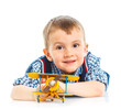 Foto: Cute little boy playing with a toy airplane Cute little boy playing with a toy airplane