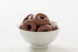 small donut topped with chocolate