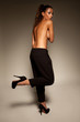 Stylish woman posing topless
