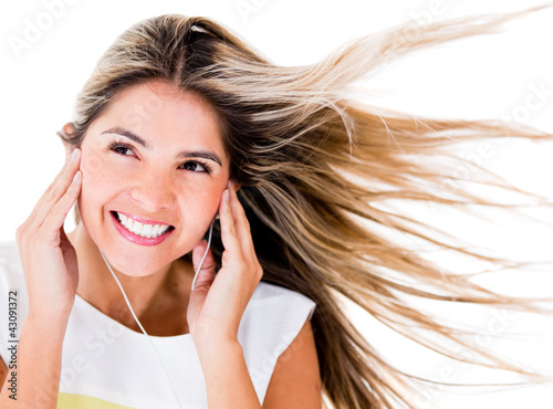 Photo: Woman listening to music Woman listening to music
