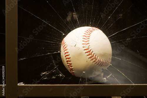 Photo: Baseball smashing glass window. Baseball smashing glass window.