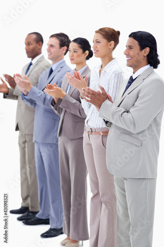 Photo: People dressed in suits smiling and applauding People dressed in suits smiling and applauding