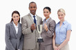 Close-up of a business team holding a cup