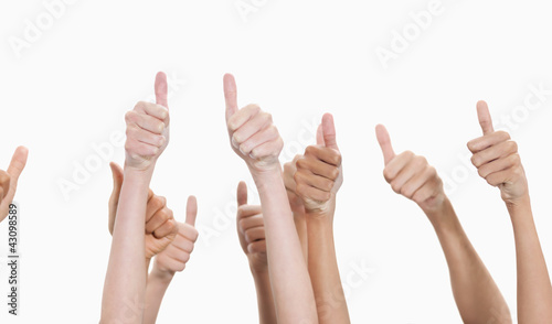 Photo: Thumbs raised and hands up Thumbs raised and hands up