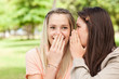 Foto: Close-up of teenagers sharing a secret Close-up of teenagers sharing a secret