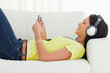 Smiling young woman watching a video
