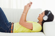 Young Latino woman watching a video