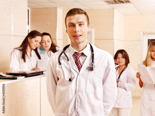 Foto: Group doctors at reception in hospital. Group doctors at reception in hospital.