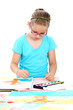 Schoolgirl painting with watercolor
