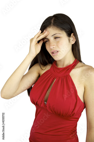 Photo: Girl with freckles and blue eyes suffering headache in pain Girl with freckles and blue eyes suffering headache in pain