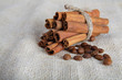 Photo: Cinnamon sticks and coffee beans on cotton canvas Cinnamon sticks and coffee beans on cotton canvas