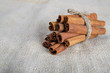 Photo: Closeup of cinnamon sticks on cotton canvas Closeup of cinnamon sticks on cotton canvas