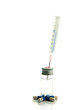 medical needle in bottle with liquid and medicine