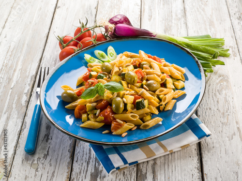Foto: cold pasta salad with pachino olives zucchins and pine kernel cold pasta salad with pachino olives zucchins and pine kernel