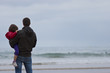 Photo: Padre con hija en cuello mirando al mar Padre con hija en cuello mirando al mar