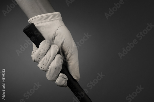 Photo: Closeup of a Golfers Gloved Hand on Club Closeup of a Golfers Gloved Hand on Club