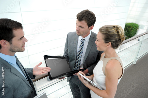 Photo: Business people meeting for contract agreement Business people meeting for contract agreement