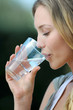 Photo: Closeup of blond woman drinking water from glass Closeup of blond woman drinking water from glass