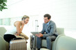 Business people in airport waiting room