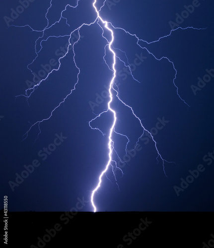 Photo: Lightning bolt at night. Lightning bolt at night.