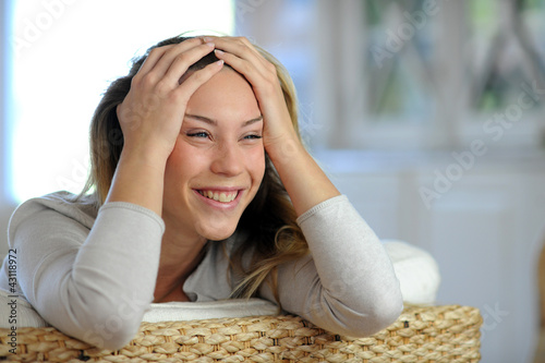Photo: Attractive blond woman relaxing at home Attractive blond woman relaxing at home
