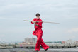 Wushoo man in red practice martial art
