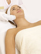 Photo: Young woman receiving laser therapy Young woman receiving laser therapy