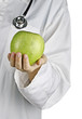 Apple in doctor's hand