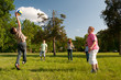 Teenage boys and girls playing with the ball in the park