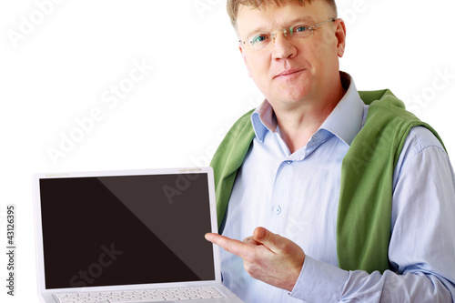 Photo: Man presenting laptop isolated on white background Man presenting laptop isolated on white background