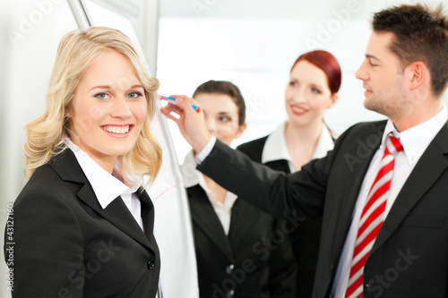 Photo: Business Team with leader in office Business Team with leader in office