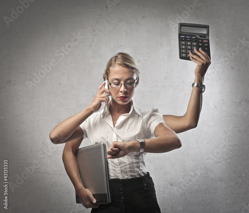 Foto: Multi-tasking businesswoman Multi-tasking businesswoman