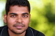 photo of handsome middle-aged Indian/asian youth with content an