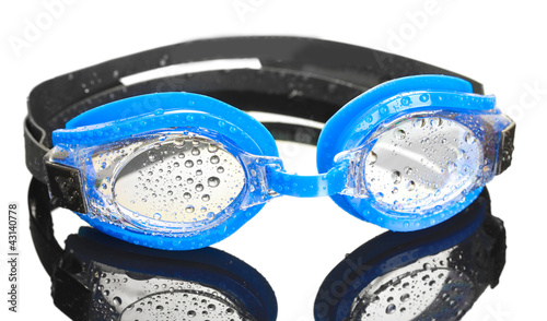 Photo: blue swim goggles with drops on grey background blue swim goggles with drops on grey background