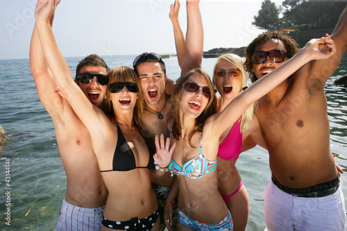 Photo: Group of friends at the beach Group of friends at the beach