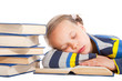 Foto: schoolgirl sleeping over the book on isolated white schoolgirl sleeping over the book on isolated white