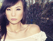 Photo: Beautiful young woman by peacock Beautiful young woman by peacock