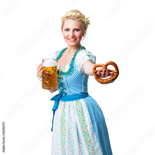 Photo: junge blonde Frau im Dirndl mit Masskrug und Brezn junge blonde Frau im Dirndl mit Masskrug und Brezn