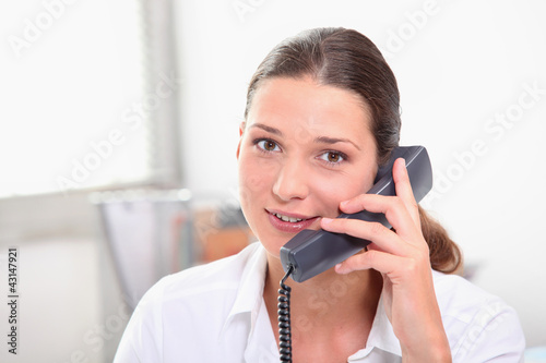 Photo: Secretary with telephone Secretary with telephone