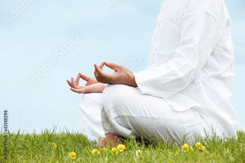 Photo: Man sitting in meditative lotus position Man sitting in meditative lotus position