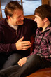 Photo: Portrait Of Father And Son Relaxing On Sofa Together Portrait Of Father And Son Relaxing On Sofa Together