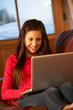 Photo: Teenage Girl Relaxing On Sofa With Laptop Teenage Girl Relaxing On Sofa With Laptop