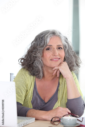 Photo: Elderly woman in front of her laptop Elderly woman in front of her laptop